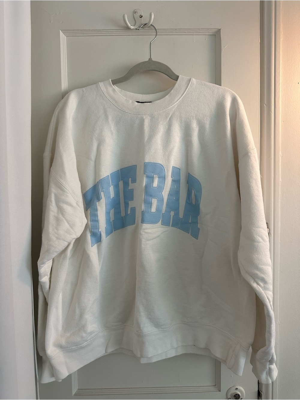 The Bar White Crewneck Sweater with Light Blue Arch Logo